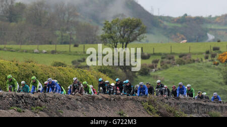 The Peloton travels along the North Antrim Coast during stage two of the 2014 Giro D'Italia, in Belfast. Stock Photo
