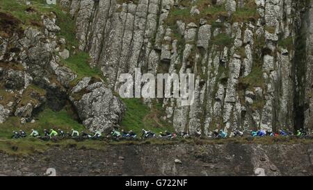 The Peloton travels along the North Antrim Coast during stage two of the 2014 Giro D'Italia, in Belfast. Stock Photo