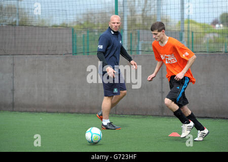 Soccer - StreetGames Football Pools Fives - Goals Plymouth. Guy Branston coaches the participants during the StreetGames Football Pools Fives at Goals Plymouth in Plymouth. Stock Photo