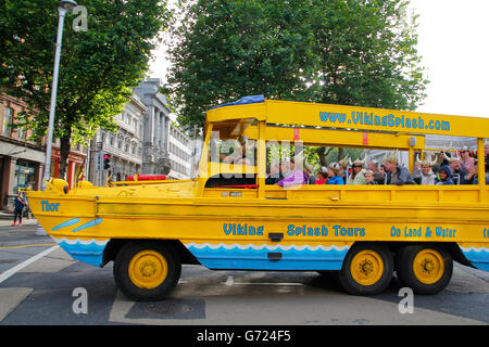 Tourists take a tour with a Viking amphibious vehicle in the streets of the center of Dublin Stock Photo