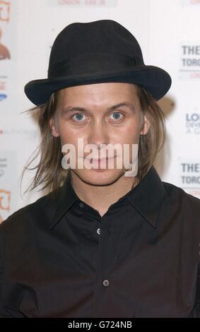 Singer Mark Owen poses for photographers backstage at the Olympic Torch Concert in The Mall, central London a free concert organised by Visit London and The Greater London Authority to celebrate the arrival of the Olympic torch in London. Stock Photo