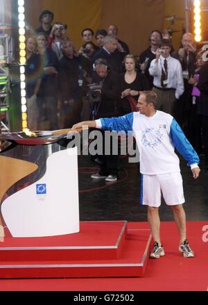 Olympic gold medallist Sir Steven Redgrave lights the Oylmpic cauldron live on stage at the Olympic Torch Concert in The Mall, central London a free concert organised by Visit London. Stock Photo