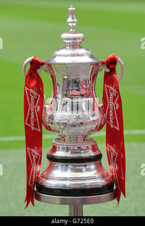 The FA Cup trophy sits on it's plinth prior to kick-off during the FA Cup Final at Wembley Stadium, London. PRESS ASSOCIATION Photo. Picture date: Saturday May 17, 2014. See PA Story SOCCER FA Cup. Photo credit should read: Nick Potts/PA Wire. Stock Photo