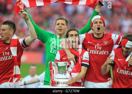 Laurent Koscielny, Goalkeeper Lukasz Fabianski, Mathieu Flamini, Olivier Giroud and Aaron Ramsey celebrating with the FA Cup Trophy Stock Photo