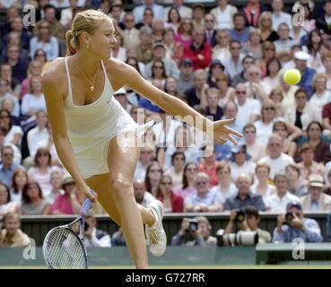 Maria Sharapova from Russia in action against Lindsay Davenport from the USA in the semi-final of the Ladies' Singles tournament of The Lawn Tennis Championships at Wimbledon, London. , NO MOBILE PHONE USE. Stock Photo