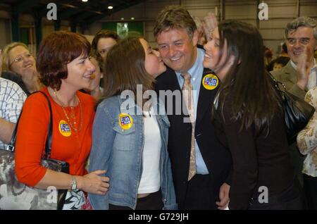 (From left) Sheila Ryan, her daughter Sarah, husband Eoin Ryan and daughter Hannah celebrate her Mr Ryan's probable success, according to party tally men, in the European elections in Ireland, at Simmonds Court halls, Dublin, Ireland. Stock Photo