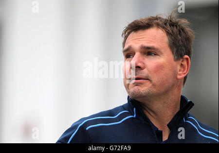 Northamptonshire Head Coach David Ripley returns to the pavilion after warming up some of his players as rain delays the start of Day Two of the LV=County Championship Division One match at Trent Bridge, Nottingham. Stock Photo