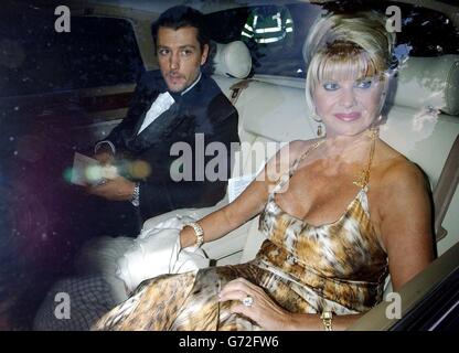 Ivana Trump and her boyfriend Rossano Rubicondi arrive for Sir Elton John's White Tie and Tiara Ball at his Berkshire mansion in Woodside, Crimp Hill, Old Windsor. All funds from the exclusive private party go to the Elton John AIDS Foundation. Stock Photo