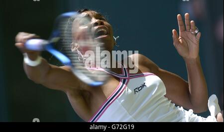 Venus Williams, the former champion, struggles against Karolina Sprem from Croatia at The Lawn Tennis Championships in Wimbledon, London. , NO MOBILE PHONE USE. Stock Photo