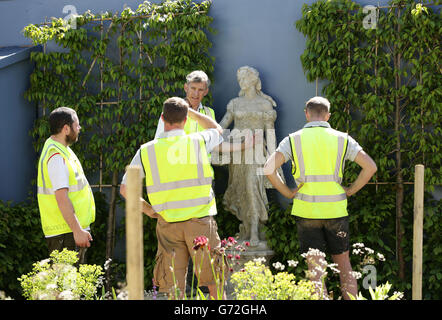 Workers making preparations ahead of the Chelsea Flower Show at the Royal Hospital in Chelsea, London. Stock Photo