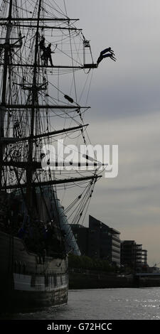 Divers Blake Aldridge and Gary Hunt who will be competing in the Red Bull Cliff Diving championships at the Serpents Lair on Inis Mor, perform a leap from the mast of the Jeanie Johnston famine ship on the River Liffey in Dublin today to promote the event on June 28. Stock Photo