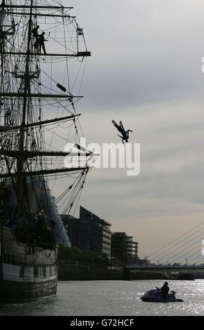 Divers Blake Aldridge and Gary Hunt who will be competing in the Red Bull Cliff Diving championships at the Serpents Lair on Inis Mor, perform a leap from the mast of the Jeanie Johnston famine ship on the River Liffey in Dublin today to promote the event on June 28. Stock Photo