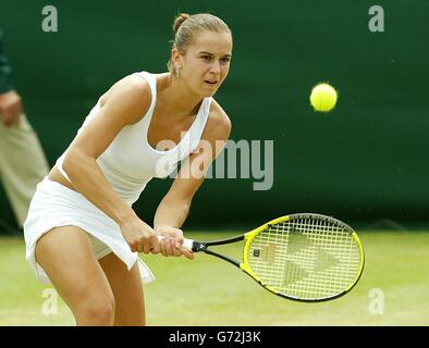 Karolina Sprem from Croatia in action against Meghann Shaughnessy from the USA at the Lawn Tennis Championships in Wimbledon, London. Sprem defeated former champion Venus Williams in her previous match to get into the third round and beat Shaughnessy in straight sets 7:6/7:6.. Stock Photo