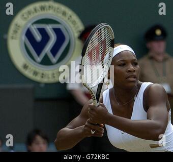 Defending champion Serena Williams from the USA in action against Tatiana Golovin from France in the fourth round of the Ladies Single tournament of The Lawn Tennis Championships at Wimbledon, London. Stock Photo