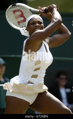 Defending champion Serena Williams from the USA in action against Tatiana Golovin from France in the fourth round of the Ladies Single tournament of The Lawn Tennis Championships at Wimbledon, London. , NO MOBILE PHONE USE. Stock Photo