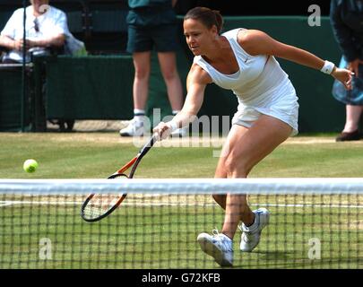 Lindsay Davenport from the USA in action against Maria Sharapova from Russia in the semi-final of the Ladies' Singles tournament of The Lawn Tennis Championships at Wimbledon, London. Stock Photo