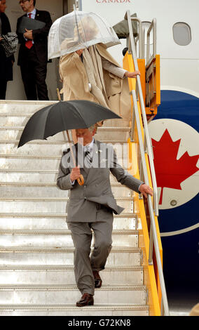 The Prince of Wales and the Duchess of Cornwall leave their aircraft after arriving in Winnipeg Manitoba, after leaving eastern Canada to fly to the central part of the country, on the third day of their Royal trip to Canada. Stock Photo