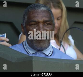 Richard Williams watches his daughter, the defending champion, Serena against fellow American Jennifer Capriati in the quarter final of the Ladies' Singles tournament of The Lawn Tennis Championships at Wimbledon, London. Williams demolished her opponent 6:1/6:1. , NO MOBILE PHONE USE. Stock Photo