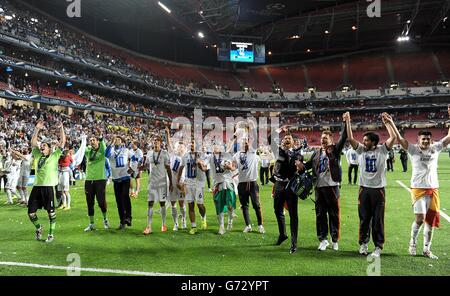 Real Madrid players celebrate after winning the penalty shootout during ...