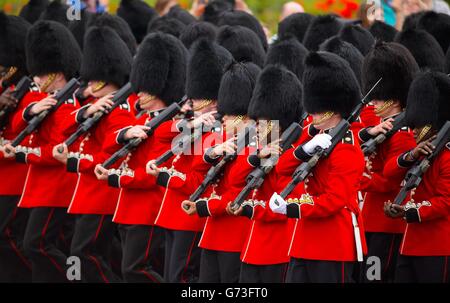 Coldstream Guards march along the Mall during the Colonel's Review, the final rehearsal of Trooping the Colour, the Queen's annual Birthday parade, in central London. Stock Photo
