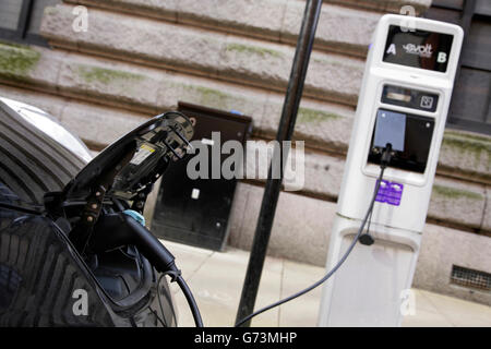 Nissan Leaf electric car being recharged in Birmingham city centre, UK. Stock Photo