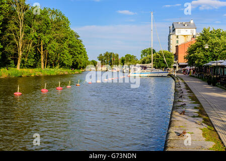 Soderkoping, Sweden - June 19, 2016: The canal promenade along Gota canal with vacant mooring places and some boats moored in th Stock Photo
