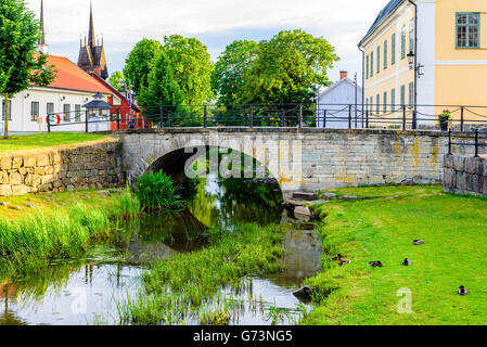 Soderkoping, Sweden - June 19, 2016: Lovely stone arch bridge over the river Storan. Stock Photo