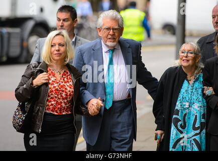 Veteran entertainer Rolf Harris arriving with daughter Bindi (left), wife Alwen at Southwark Crown Court, London, where he denies 12 counts of indecent assault between 1968 and 1986. Stock Photo