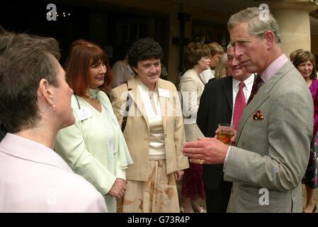 The Prince of Wales (right) speaks to (from left) Susan Palmer from Elwick Hall CofE Primary in Hartlepool, Cheryl Millard from Colmore Junior School in Birmingham, Susan Morton from Lower Darwen Primary in Lancashire and Charles Morris from Bromley Heath Junior School in Bristol at a reception for 84 primary school head-teachers at his Highgrove Estate in Gloucestershire. The heads were chosen from a list of 300 improved successful primary schools published in the annual report of Her Majesty's Chief Inspector of Schools 2002-2003. Stock Photo