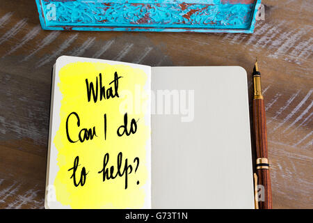 Question What Can I Do To Help ? handwritten on notebook Stock Photo