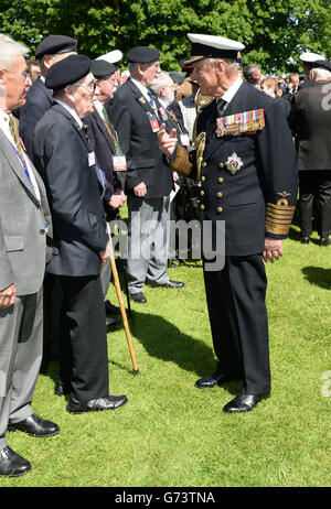 Prince Philip meets veterans at Bayeux Cemetery where they attended a commemorative service to mark the 70th anniversary of the D-Day landings during World War II. Stock Photo