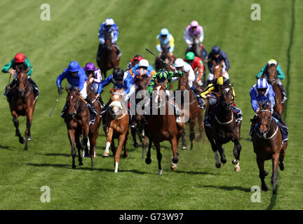 Taghrooda (right) ridden by Paul Hanagan wins the Investec Oaks (In Memory Of Sir Henry Cecil) during Investec Ladies Day at Epsom Downs Racecourse, Surrey. Stock Photo
