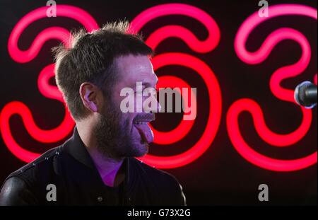 Tom Meighan of Kasabian performing at HMV in London to celebrate the release of their fifth album '48:13'. Stock Photo