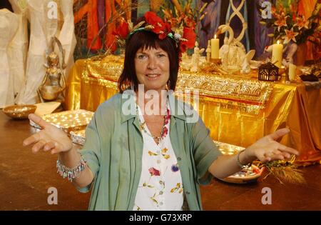 Goddess Conference co-organiser Kathy Jones by the main altar in Glastonbury town hall. The conference, explores pre-Christian goddess worship and celebrating female spirituality. Stock Photo