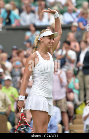 Tennis - 2014 Wimbledon Championships - Day Two - The All England Lawn Tennis and Croquet Club. Germany's Sabine Lisicki celebrates defeating Israel's Julia Glushko Stock Photo