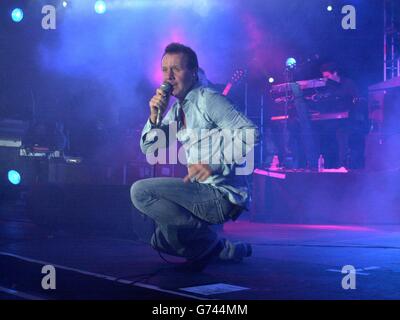 Jim Kerr performs with Simple Minds during the Guilfest at Stoke Park in Guildford. Stock Photo