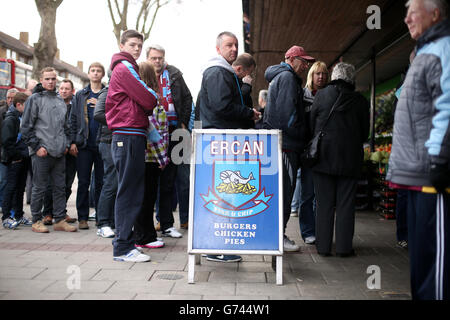 General view of fans queuing for refreshments outside Upton Park Stock Photo