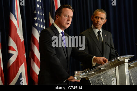 British Prime Minister David Cameron (left) holds a press conference with US President Barack Obama during the G7 Summit held at the EU headquarters in Brussels, Belgium. Stock Photo