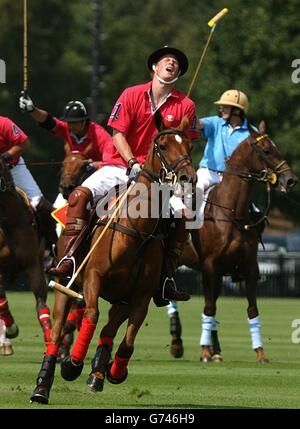 Prince Harry in action during a polo match at Windsor Great Park, playing as captain of The Prince of Wales team v Hurlingham. Stock Photo