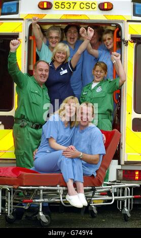 Karen Shand (bottom left), 40, from Kirkcaldy, Fife, celebrates with partner William Logan and staff outside Victoria Hospital, Kirkcaldy, Scotland, after winning 1 million on the live television quiz show 'The Vault'. Ms Shand clinched the life-changing prize - the largest amount of money ever won on live TV - after she answered six questions correctly. Stock Photo