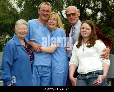 Karen Shand (centre), 40, from Kirkcaldy, Fife, celebrates with her daughter Amie, 16, grandparents Joe and Helen Drybrugh and paramedic partner William Logan outside Victoria Hospital, Kirkcaldy, Scotland. Karen won 1 million on the live television quiz show 'The Vault'. Ms Shand clinched the life-changing prize - the largest amount of money ever won on live TV - after she answered six questions correctly. Stock Photo