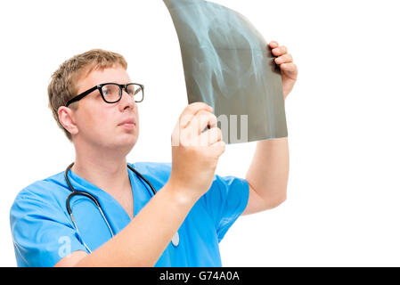 radiologist examines the hip part of the patient carefully shot on a white background Stock Photo