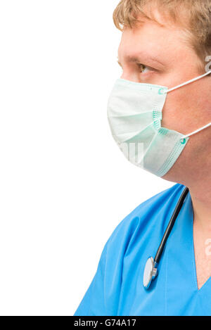 Portrait of caucasian male surgeon wearing surgical gown in operating ...