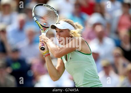 Caroline Wozniacki returns to Camila Giorgi during the AEGON International at Devonshire Park, Eastbourne. Stock Photo