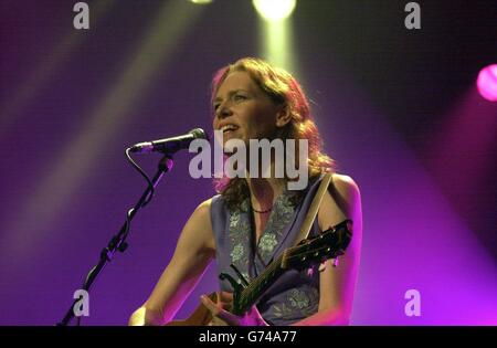 Singer Gillian Welch performing on stage at the 40th Cambridge Folk Festival. Stock Photo