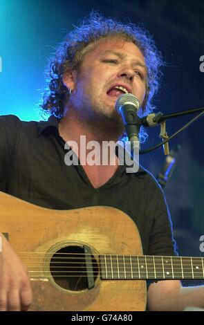 Mark Chadwick of the Levellers performing on stage at the 40th Cambridge Folk Festival. Stock Photo