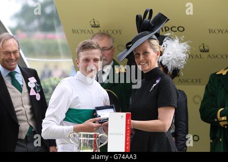 Sophie, Countess of Wessex presents winning jockey of Born In Bombay, David Probert after victory in the Britannia Stakes during Day Three of the 2014 Royal Ascot Meeting at Ascot Racecourse, Berkshire. Stock Photo