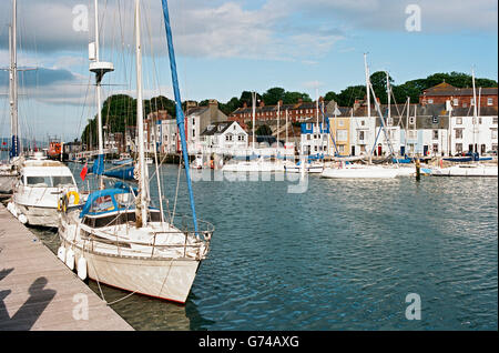 Weymouth harbour, Dorset,  Southern England, with yachts by the quayside. Stock Photo