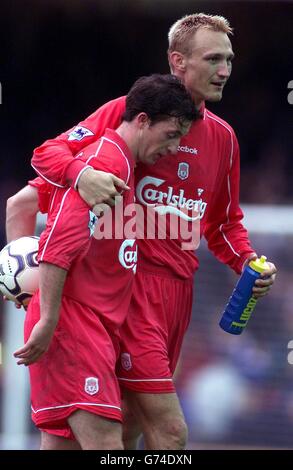 Liverpool's Hat trick hero Robbie Fowler is congratulated by Sami Hyypia as they leave the field at the final whistle against Leicester City in the FA Barclaycard Premiership game between Leicester and Liverpool at Filbert Street, Leicester. NO WEBSITE/INTERNET USE OF PREMIERSHIP MATERIAL UNLESS SITE IS REGISTERED WITH FOOTBALL ASSOCIATION PREMIER LEAGUE Stock Photo