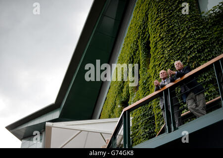 Spectators watch over the outside courts from Centre Court during day three of the Wimbledon Championships at the All England Lawn Tennis and Croquet Club, Wimbledon. Stock Photo